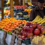 Colorful fruit market stall in Sarajevo, Bosnia, showcasing vibrant fresh produce and lively atmosphere.